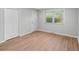 This is a bedroom with natural light, light colored wood flooring, and white trim at 44 Kessler Blvd W Dr, Indianapolis, IN 46208