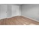 A bedroom with natural light, wood-style flooring, white trim and doors at 44 Kessler Blvd W Dr, Indianapolis, IN 46208