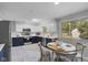Bright kitchen with stainless steel appliances, white and navy blue cabinets, and a breakfast table at 44 Kessler Blvd W Dr, Indianapolis, IN 46208