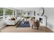 Bright living room with modern decor, large windows, and wood-style flooring at 44 Kessler Blvd W Dr, Indianapolis, IN 46208