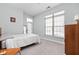Neutral bedroom with large window and exterior door at 450 E Ohio St # Apt 118, Indianapolis, IN 46204