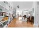Open-concept living room with hardwood floors and a built-in bookcase at 450 E Ohio St # Apt 118, Indianapolis, IN 46204