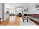 Living room featuring a fireplace and an open floorplan into the dining area at 450 E Ohio St # Apt 118, Indianapolis, IN 46204
