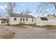Exterior view of the house with backyard, storage shed and asphalt drive at 518 E College Ave, Brownsburg, IN 46112