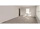 Neutral bedroom featuring new carpet and a bright window at 518 E College Ave, Brownsburg, IN 46112
