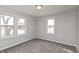 Bedroom featuring neutral walls, carpet and two large windows at 518 E College Ave, Brownsburg, IN 46112
