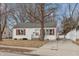 Charming home showcasing its curb appeal with a well-manicured lawn and inviting facade at 518 E College Ave, Brownsburg, IN 46112
