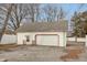 Detached two car garage with updated doors and neutral paint at 518 E College Ave, Brownsburg, IN 46112