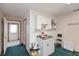 Small kitchenette with basic appliances, storage, and functional design at 518 E College Ave, Brownsburg, IN 46112