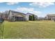 Wide angle view of backyard between houses and a view of pond at 5546 W Vistaview Trl, McCordsville, IN 46055