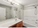 Bathroom with shower-tub combo, vanity, large mirror, and modern lighting at 5546 W Vistaview Trl, McCordsville, IN 46055