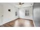 Bright bedroom with hardwood floors, two windows, and ceiling fan at 5546 W Vistaview Trl, McCordsville, IN 46055