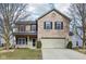 Charming two-story home with brick facade, landscaped front yard, and attached two-car garage at 5546 W Vistaview Trl, McCordsville, IN 46055