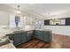 Stylish kitchen featuring granite counters, white subway tile backsplash, stainless steel appliances, and wood floors at 5546 W Vistaview Trl, McCordsville, IN 46055