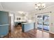 Spacious kitchen with eat in island, stainless steel appliances, and glass door access to porch at 5546 W Vistaview Trl, McCordsville, IN 46055