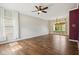 Bright living room featuring hardwood floors and ample natural light from large windows at 5546 W Vistaview Trl, McCordsville, IN 46055