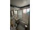 Bathroom with a worn tub, dated fixtures, and an overall unkempt condition at 5834 42Nd St, Indianapolis, IN 46226