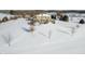 The attractive rear patio can be seen in this snowy view of the back of the home at 5895 W 265 N, Columbus, IN 47201