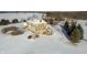 Aerial view of the back of the home and surrounding land, all covered in winter snow at 5895 W 265 N, Columbus, IN 47201