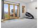 Finished basement featuring grey carpet, French doors and a massage chair at 5895 W 265 N, Columbus, IN 47201