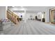 Large finished basement with grey carpet, natural wood staircase, pool table and walk-out access at 5895 W 265 N, Columbus, IN 47201