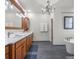 Elegant bathroom featuring double vanity, modern fixtures, and freestanding soaking tub at 5895 W 265 N, Columbus, IN 47201