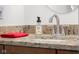 Bathroom sink with granite countertop, brushed nickel faucet and red hand towel at 5895 W 265 N, Columbus, IN 47201