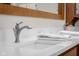Close-up of a bathroom vanity with quartz countertop, modern faucet, and stylish accents at 5895 W 265 N, Columbus, IN 47201