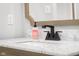 Close-up of bathroom vanity with a marble countertop and modern fixtures at 5895 W 265 N, Columbus, IN 47201