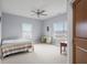Light-filled bedroom with hardwood floors and large windows at 5895 W 265 N, Columbus, IN 47201