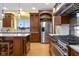 Spacious kitchen features stainless steel appliances, custom cabinets, hardwood floors, and marble countertops at 5895 W 265 N, Columbus, IN 47201