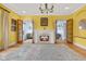 Bright living room showcasing a fireplace and inviting french doors at 5895 W 265 N, Columbus, IN 47201