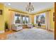 Bright living room with hardwood floors, large windows, and comfortable seating at 5895 W 265 N, Columbus, IN 47201
