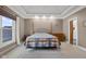 Spacious main bedroom with tray ceiling, neutral walls, and large window at 5895 W 265 N, Columbus, IN 47201