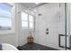Beautiful glass enclosed shower with white tile and black tiled floor at 5895 W 265 N, Columbus, IN 47201