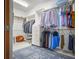 Organized walk-in closet with built-in shelving and ample hanging space at 5895 W 265 N, Columbus, IN 47201