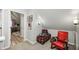 Cozy finished attic space with a seating area, carpet flooring, and light gray walls at 602 E Beecher St, Indianapolis, IN 46203