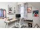 Finished attic space with laminate flooring, a desk, and a window at 602 E Beecher St, Indianapolis, IN 46203