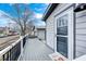 Back porch leading to a gray house with a black trimmed door at 602 E Beecher St, Indianapolis, IN 46203