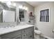 Bathroom featuring dual sinks, modern fixtures, and stylish vanity at 602 E Beecher St, Indianapolis, IN 46203