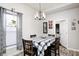 Bright dining room with a chandelier and a window offering natural light at 602 E Beecher St, Indianapolis, IN 46203