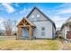Attractive two-story home showcasing a welcoming covered porch and a well-kept yard at 602 E Beecher St, Indianapolis, IN 46203