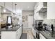 Modern kitchen with stainless steel appliances, granite countertops, and ample cabinet space at 602 E Beecher St, Indianapolis, IN 46203