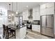 Modern kitchen with stainless steel appliances, granite counters, and white cabinetry at 602 E Beecher St, Indianapolis, IN 46203