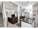 Open-concept living room features modern decor, wood floors, and access to a stylish kitchen at 602 E Beecher St, Indianapolis, IN 46203