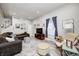 Bright living room features a comfortable sofa, area rug, and neutral décor at 602 E Beecher St, Indianapolis, IN 46203