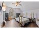Bedroom featuring a gold metal bed frame and a gothic arched window at 6428 Bluff Crest Ct, Indianapolis, IN 46217