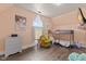 Cozy bedroom featuring a bunk bed, natural light, and comfortable chair at 6428 Bluff Crest Ct, Indianapolis, IN 46217