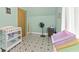 Bedroom with colorful toy storage and space for a changing table at 6428 Bluff Crest Ct, Indianapolis, IN 46217