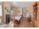Spacious dining room featuring hardwood floors and vintage charm, with water cooler at 6428 Bluff Crest Ct, Indianapolis, IN 46217